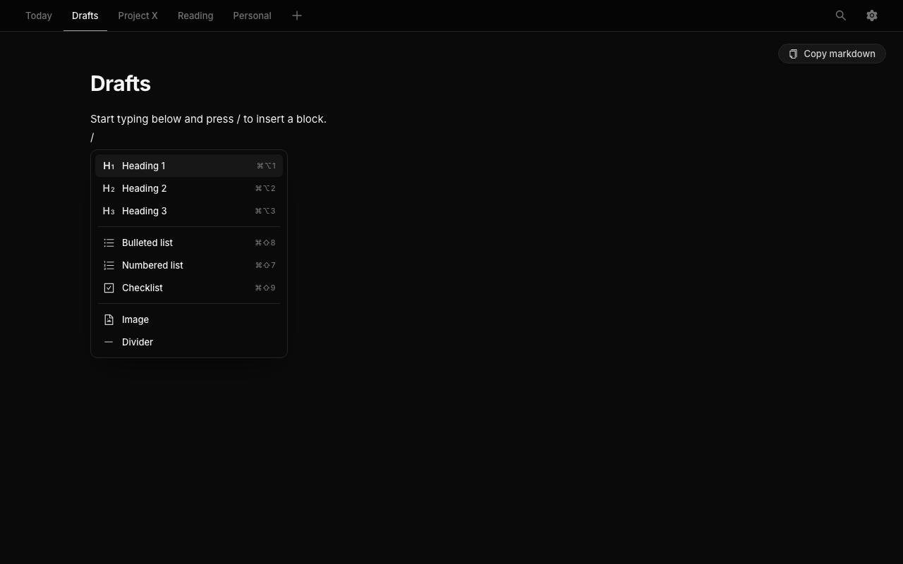 The slash command menu open in a note, listing block options